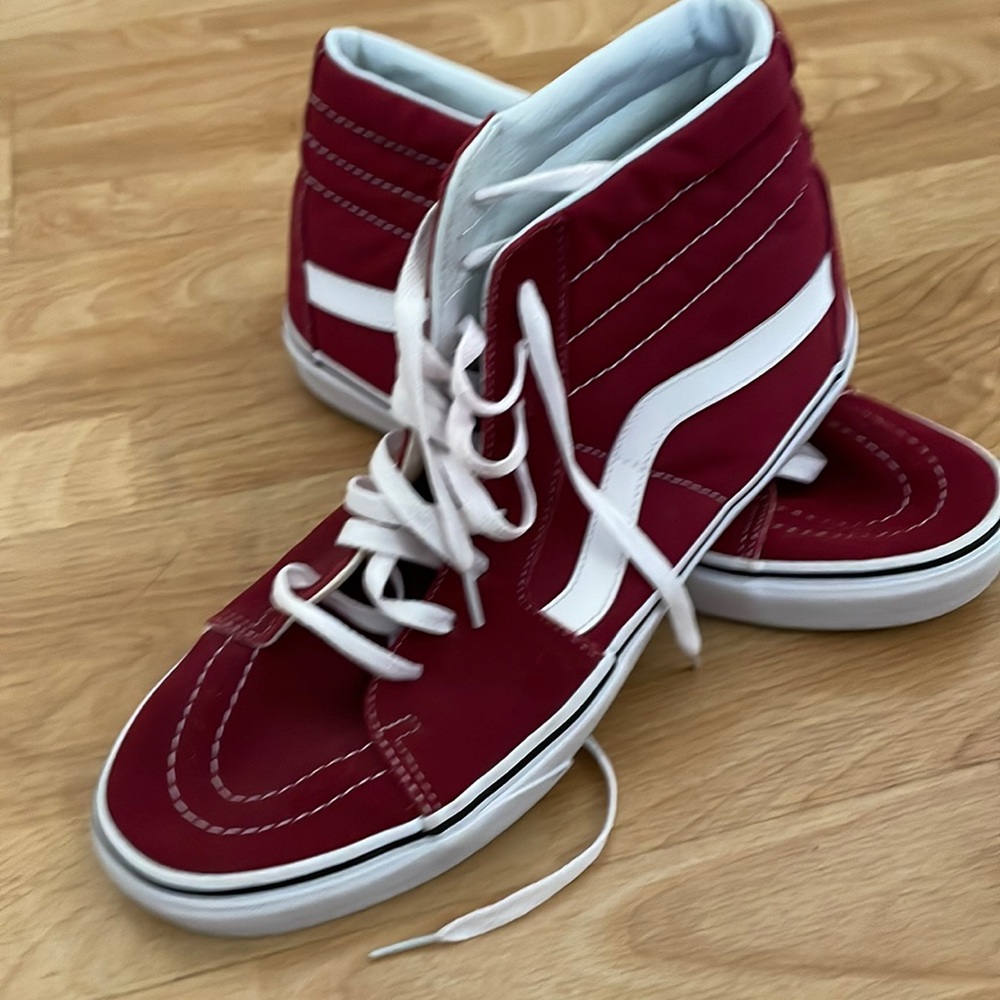 Red Vans hightop sneakers